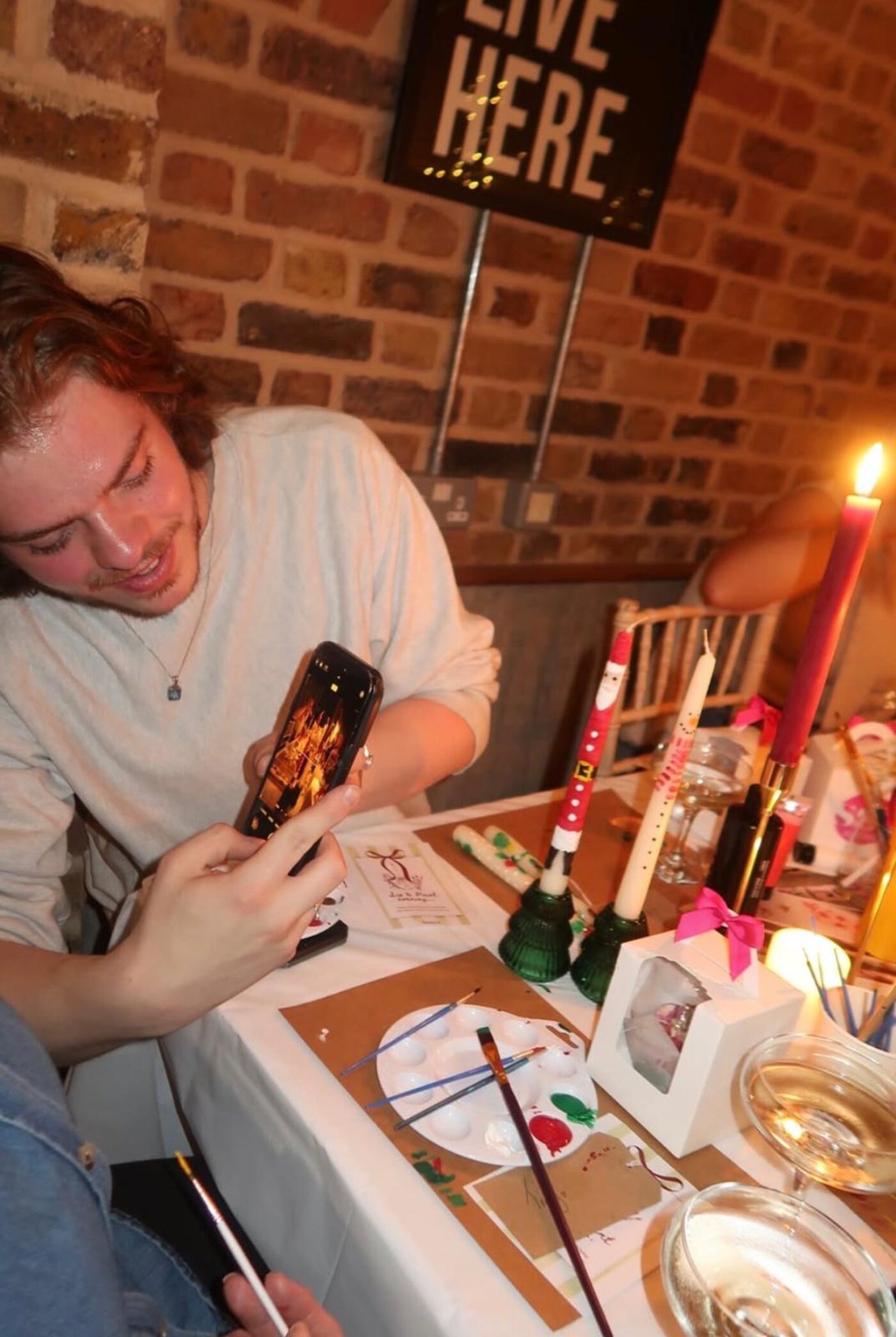 Guest photographing his finished Santa candle