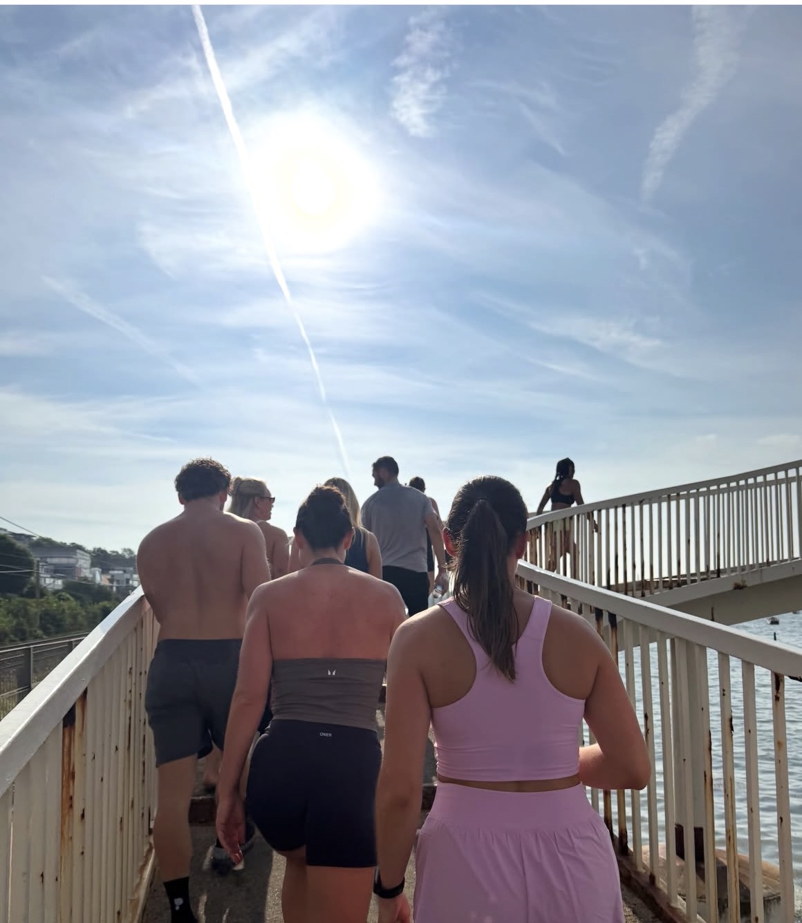 The run club crossing the footbridge on the seafront